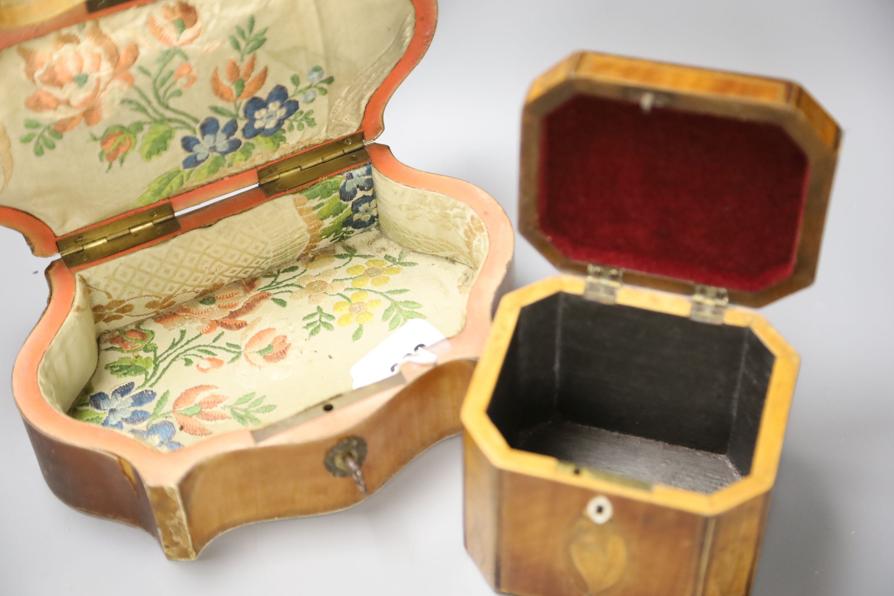 A marquetry serpentine work box, length 23.5cm, and an octagonal tea caddy